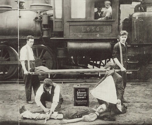 Railroad First Aid demonstration with a Johnson & Johnson First Aid Kit, from our archives.